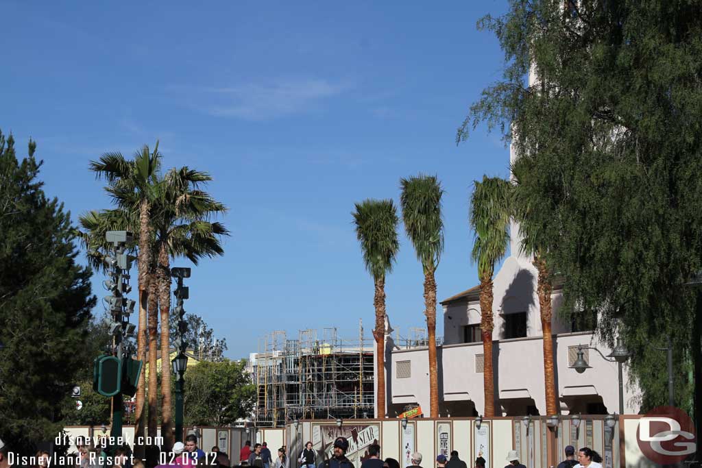 Looking down toward Buena Vista Street palm trees have sprung up along the Carthay side and another view of the trees around the fountain.