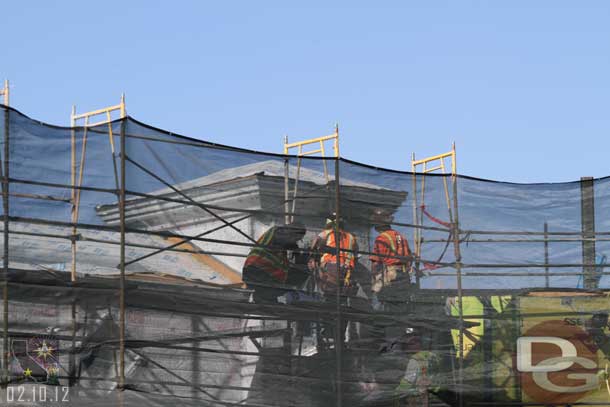 A crew working on preparing the facade above for its exterior coat of concrete (or is it stucco)