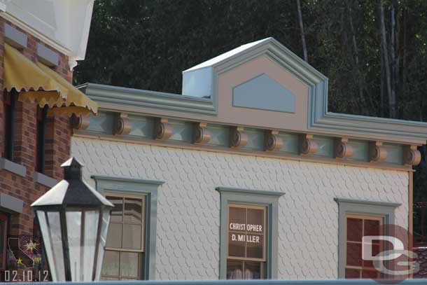 The scaffolding is down on the left side above the restrooms.  The repainting looks to be complete there.