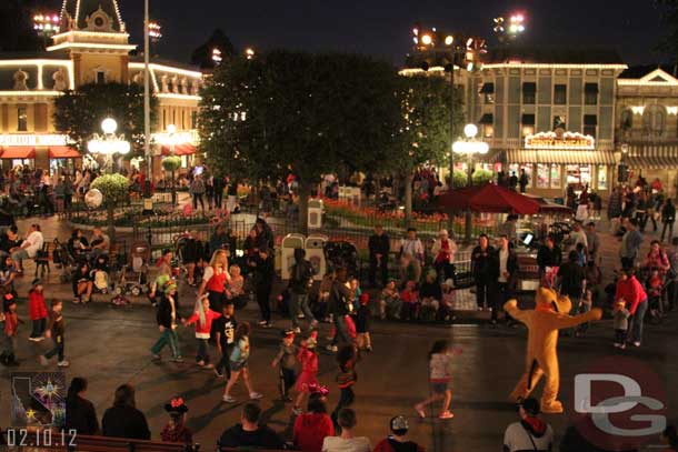 Pluto out entertaining guests before the parade.  He was playing follow the leader with a bunch of kids.