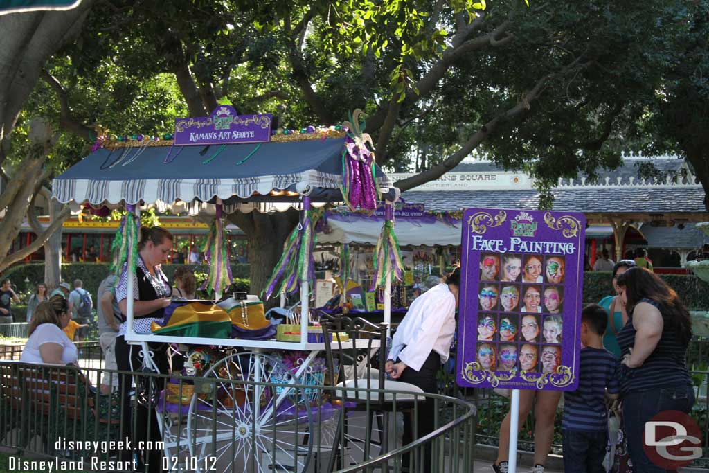 A face painting area set up near the fountain.