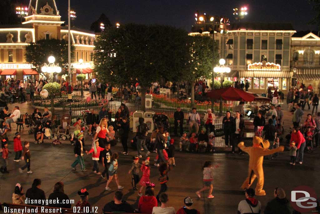 Pluto out entertaining guests before the parade.  He was playing follow the leader with a bunch of kids.