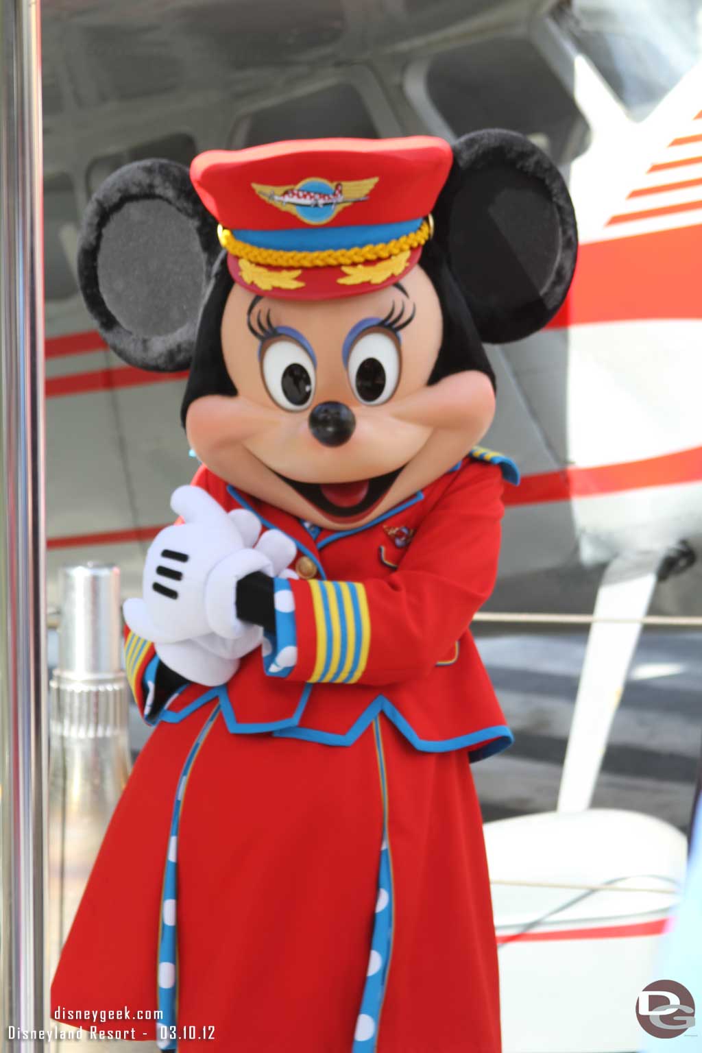 Minnie also wears the Flight Attendant outfit for pictures near her plane.  I thought the aviator outfit worked better here.. but I guess they want to match the show.