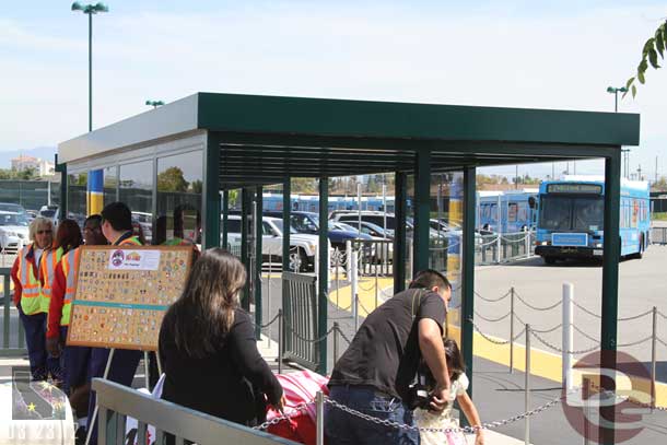 There is a pin trading board by the bus stops to occupy you while you wait.