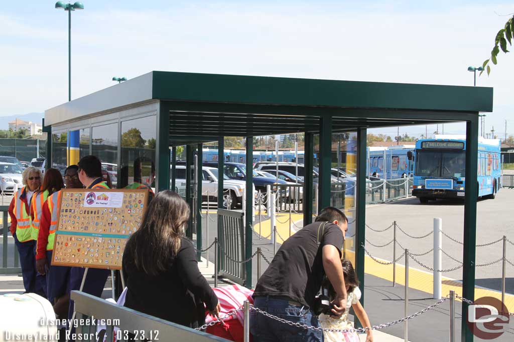 There is a pin trading board by the bus stops to occupy you while you wait.