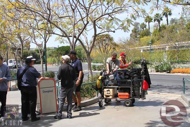 A film crew at the tram stop.