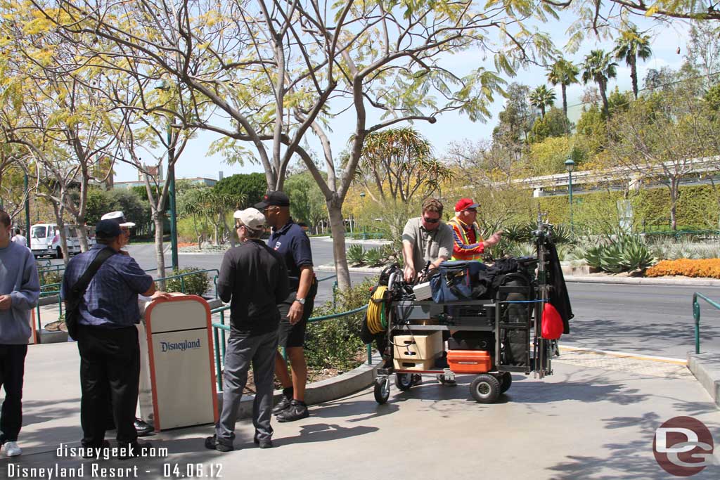 A film crew at the tram stop.