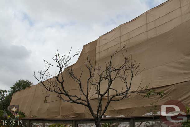 The Tough to Be a Bug theater is behind a tarp as the mural is repainted.