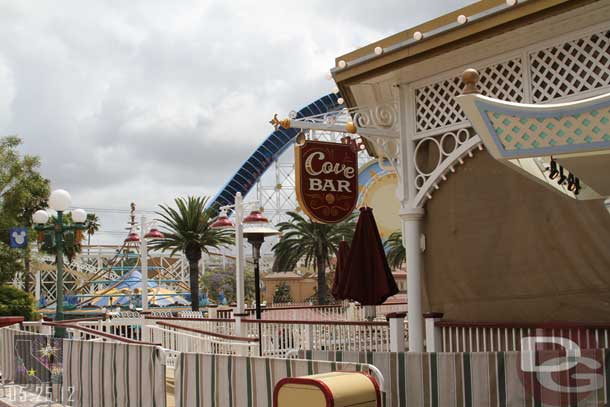 The walls around the Cove Bar are down, but a tarp is still up around the bar area.