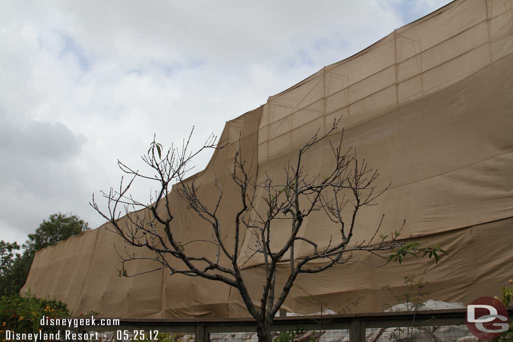 The Tough to Be a Bug theater is behind a tarp as the mural is repainted.