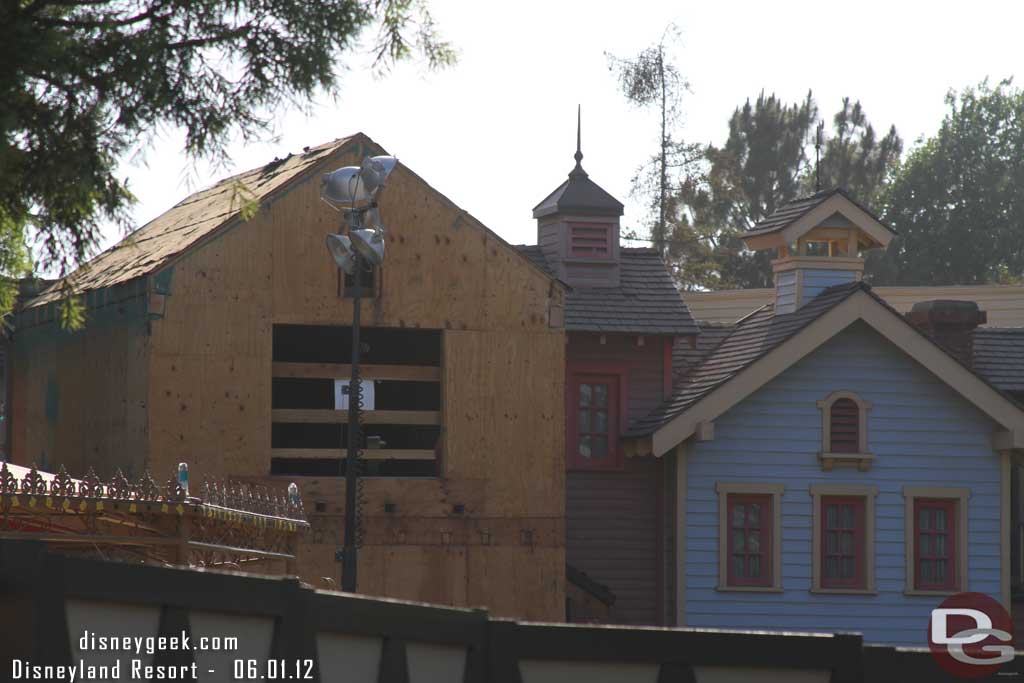 The facade has been stripped down to the plywood behind Plaza Gardens.