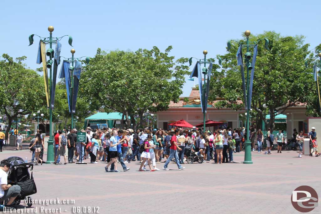 A long line of cast members and their guests waiting for their wristbands which would allow them onto Buena Vista Street and into Cars Land.