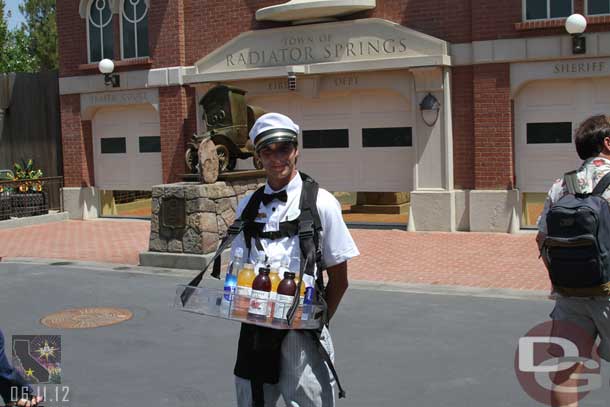 There are no vending carts in Cars Land... so they walk around selling stadium style.  