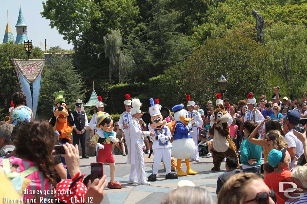 The Disneyland Band and some characters in front of the Castle.