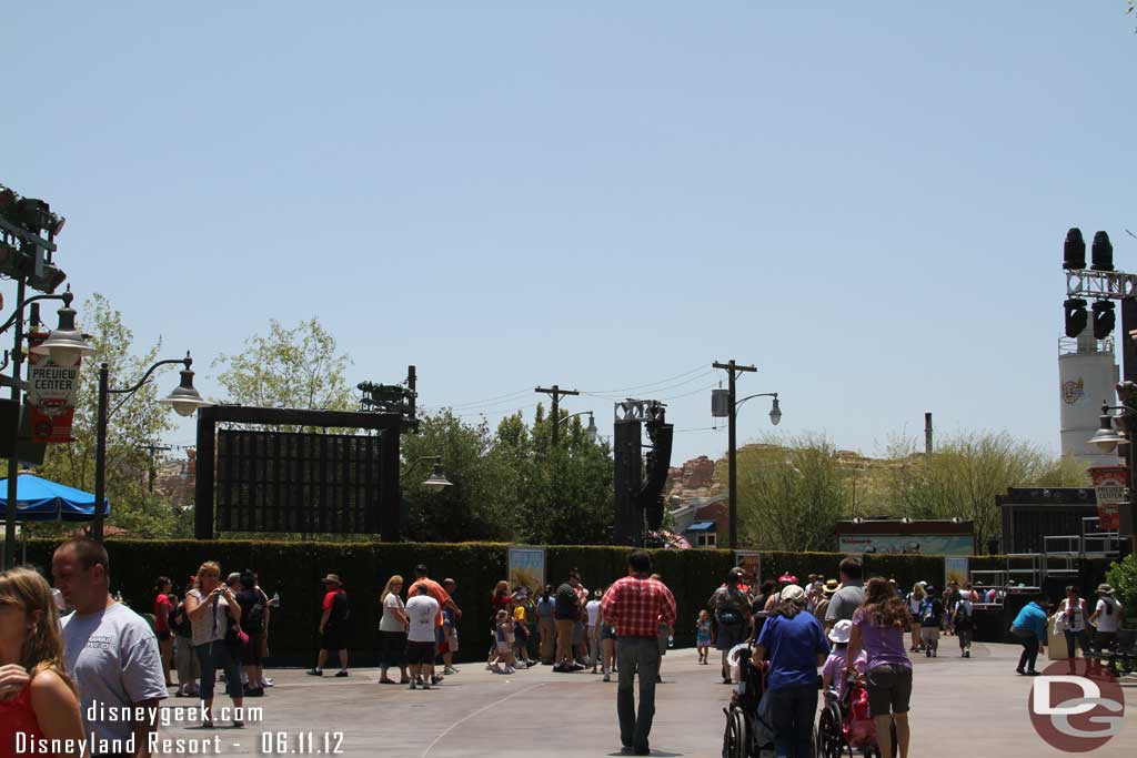 Working my way up the parade route. The construction walls are gone and hedges are now around Maters.  They have set up more gear for the opening celebration.