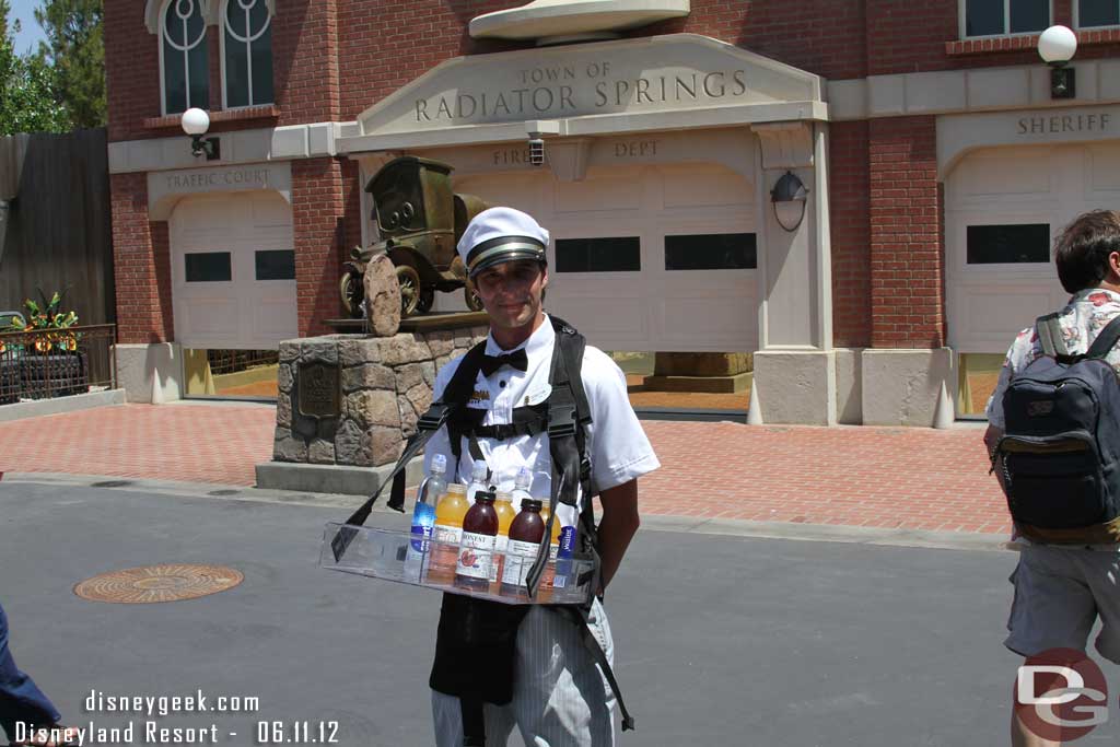 There are no vending carts in Cars Land... so they walk around selling stadium style.  