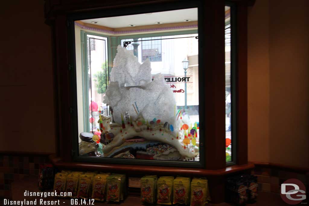 The window features a model of Rock Candy Mountain, an attraction that was designed for Disneyland but never built.