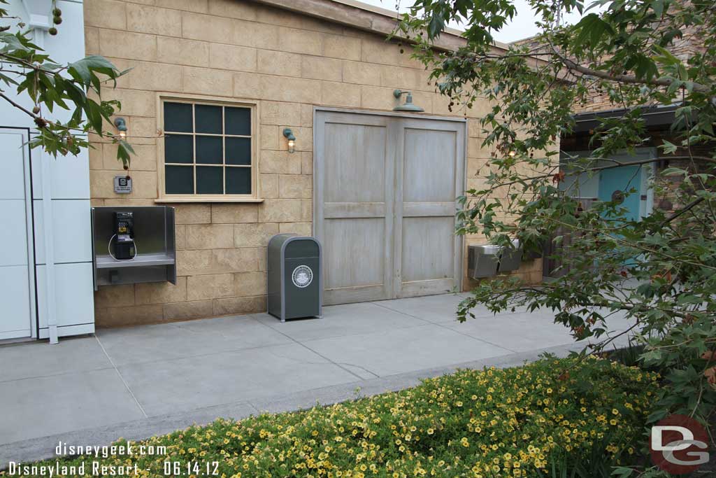 Looking toward the restrooms (note the only ones in Cars Land).  There is also one telephone.