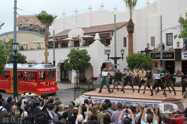 A Red Car Trolley pulling up.