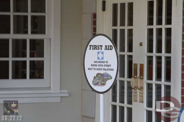 A sign by the old First Aid station directing guests to the new location.