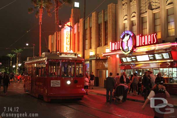 A Red Car making its way down Hollywood Blvd.