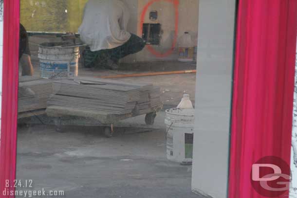Noticed one of the windows was not covered so took a look inside.  They are putting in the tile floor.  Looks like there is quite a ways to go still.