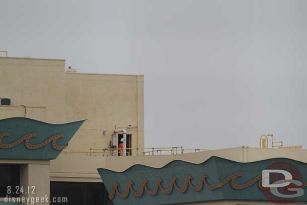 A worker on the roof of the Paradise Pier Hotel.