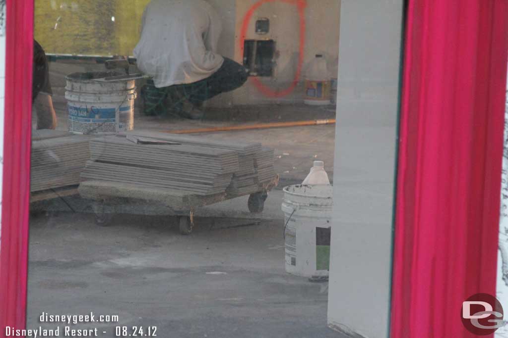 Noticed one of the windows was not covered so took a look inside.  They are putting in the tile floor.  Looks like there is quite a ways to go still.