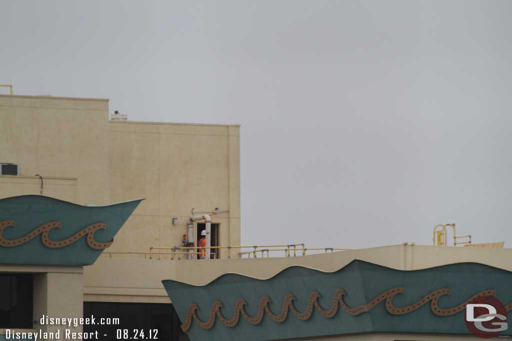 A worker on the roof of the Paradise Pier Hotel.