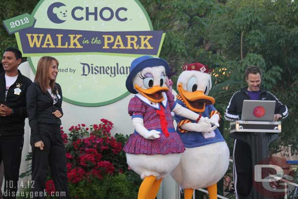 The characters and ambassadors stayed on the stage to cheer on the walkers as they began their 5K course through the resort.