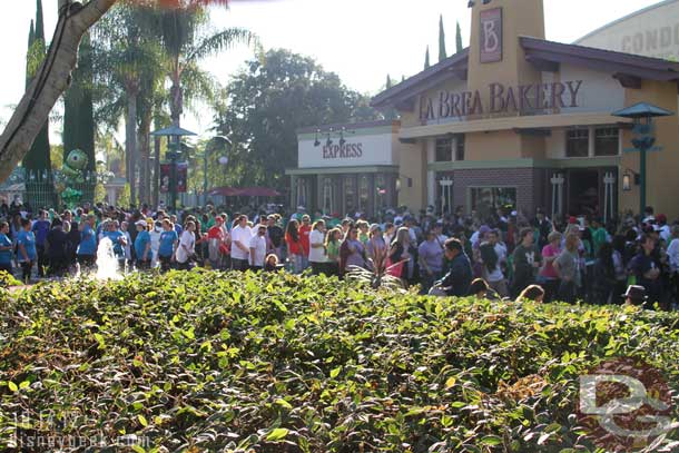 The walkers nearest are heading toward the finish, in the background you can still see walkers exiting DCA and heading to Disneyland.