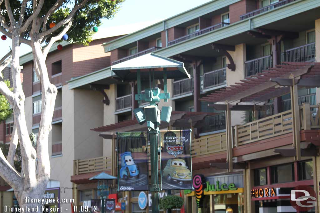 The banners have gone back to the Cars Land ones.  Guessing Christmas will go up next week.