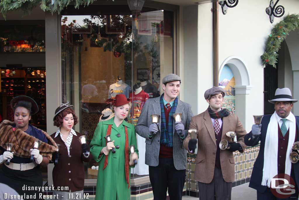 The Community Bell Ringers performing by the Five & Dime.