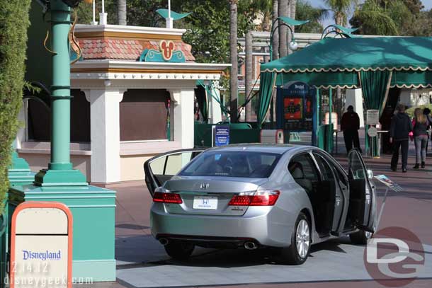 Another car between the security tents and tram stop.