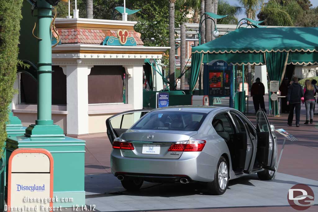 Another car between the security tents and tram stop.