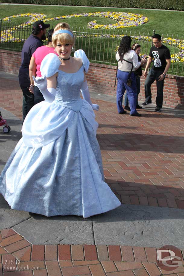 Cinderella out front greeting guests entering the park.