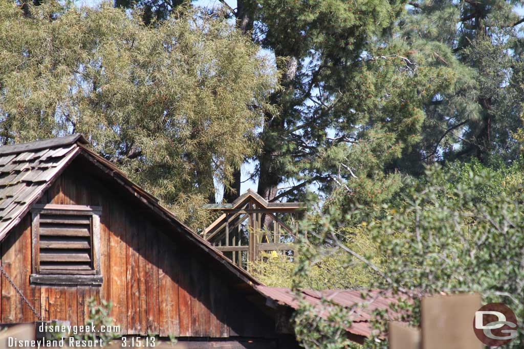 The frames for the building are starting to take shape through the trees.