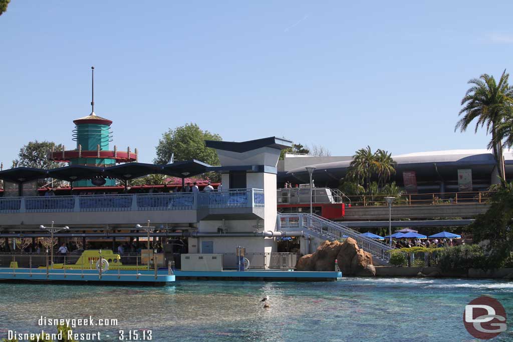 Monorail Red was stuck at the Tomorrowland Station.  They pulled up and prepared to tow it back to the round house.