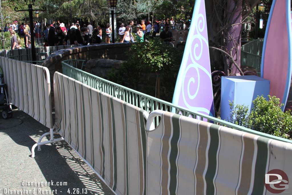 Painting the railing near the Mad Tea Party.