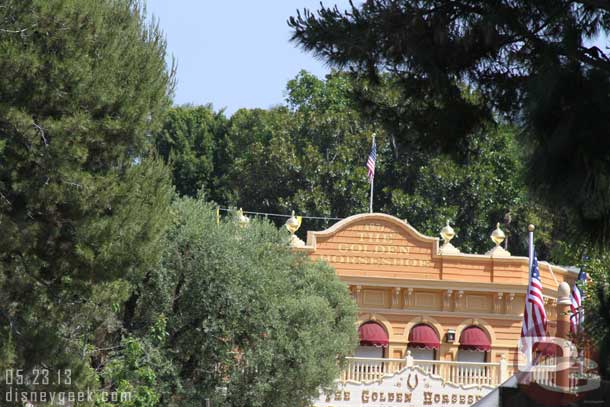 If you look up as your roam around the parks you will see safety lines and barriers on several rooftops.  Here you can just barely see one on the Golden Horseshoe (I did not have time to go for a Mark Twain ride to get a better picture)