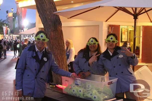 Cast Members handing out free Eye Glasses to the first couple of thousand guests.  The cast members were having fun and in good spirits.