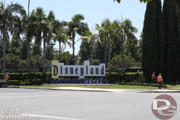 The Disneyland Hotel has received a new sign.  Cast Members were still putting the finishing touches on the landscaping this afternoon.