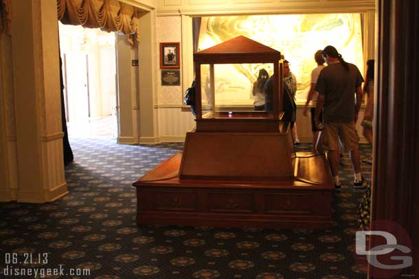 The display case and bench that used to be in the center room of the gallery has moved to where the ticket display case in the Opera house lobby.