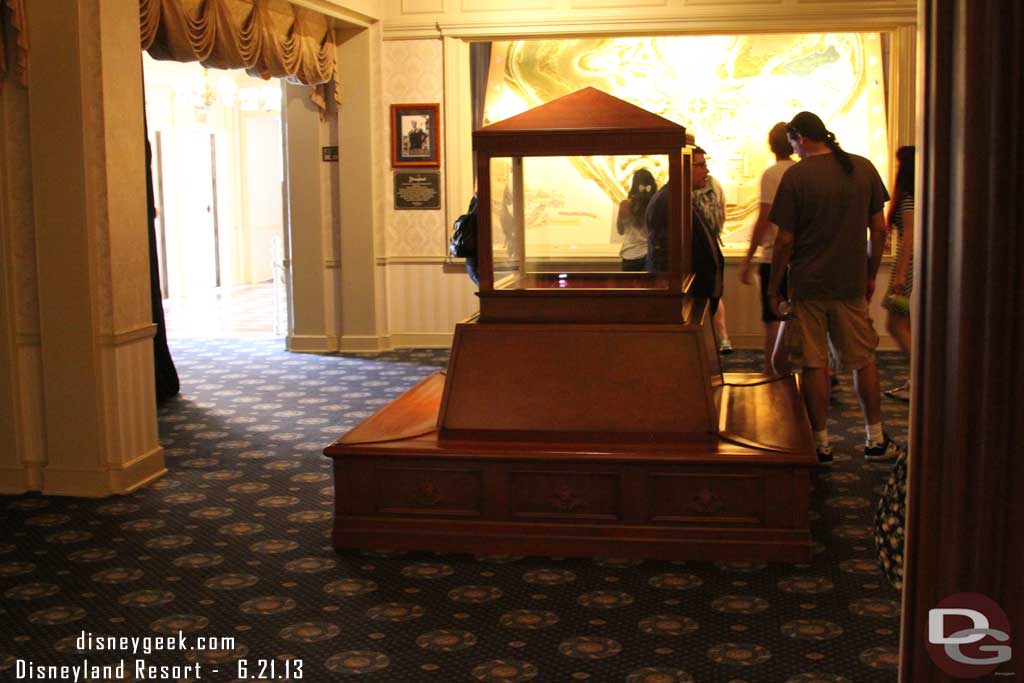 The display case and bench that used to be in the center room of the gallery has moved to where the ticket display case in the Opera house lobby.