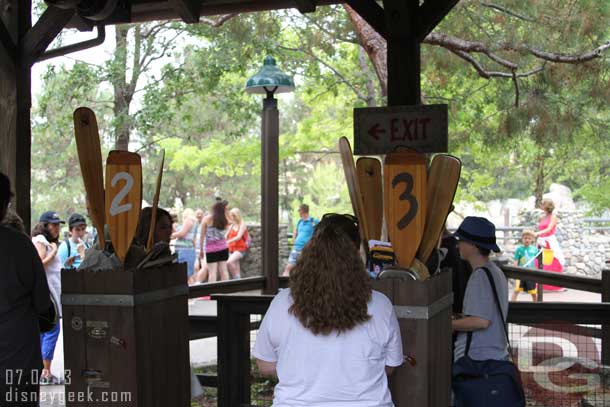 They no longer have Cast Members at each machine.  You are on your own to put your ticket in and get your Fastpass.  There was one CM nearby to answer questions.