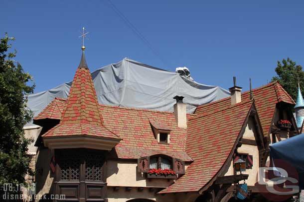 Scaffolding lines the rooftops in Fantasyland as they work on hiding the safety railings.