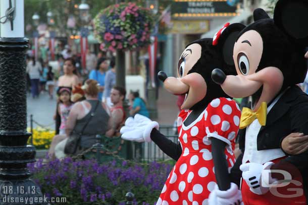 Mickey and Minnie strolling through Town Square on their way to take photos with guests.