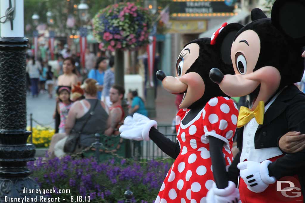 Mickey and Minnie strolling through Town Square on their way to take photos with guests.