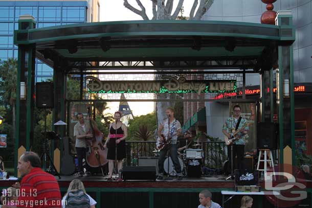 A band performing on the Downtown Disney stage.