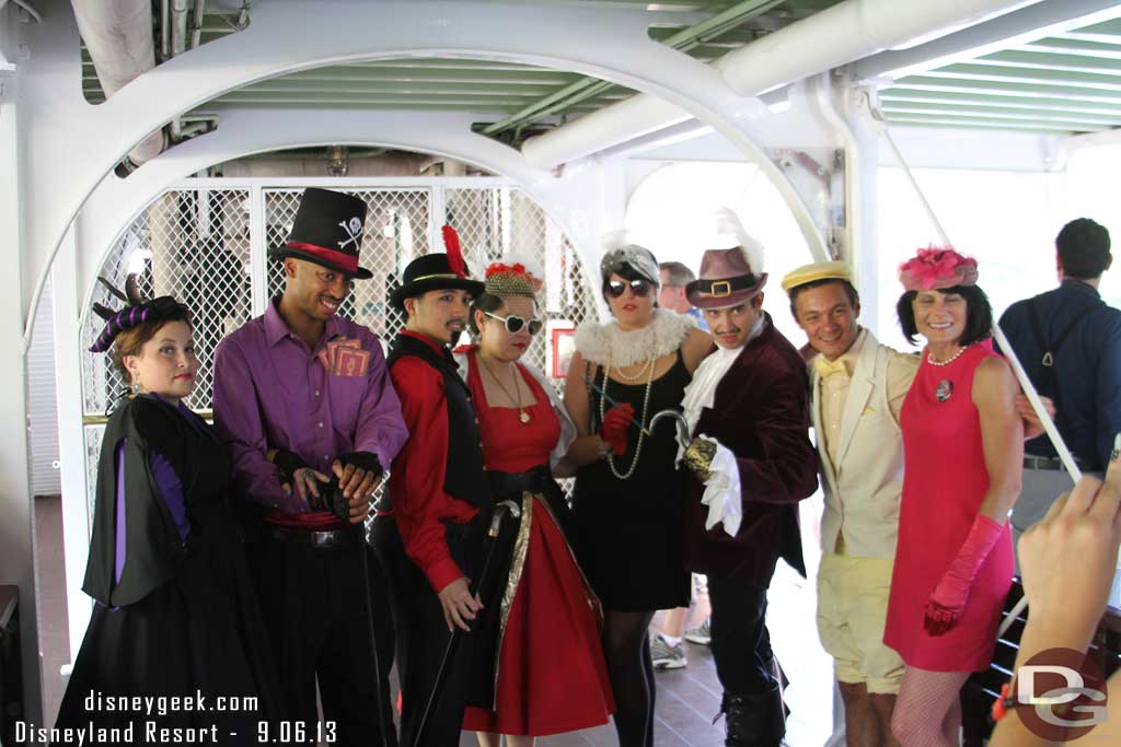 A group of Dapper Day guests posing for pictures on the lower deck.